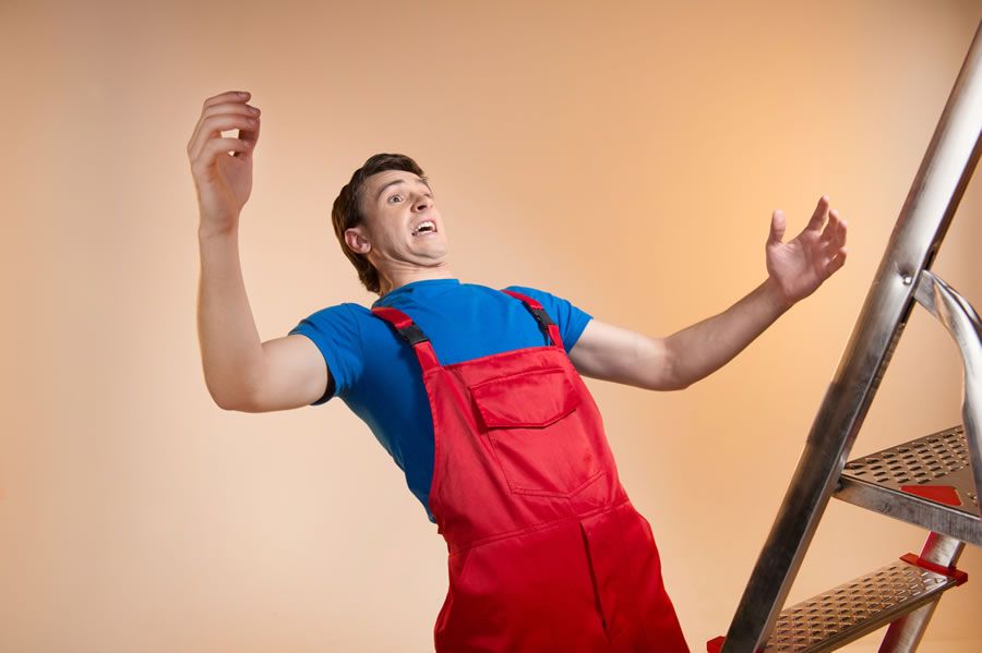 A man falling off a ladder