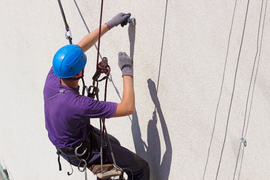 A worker on a ladder