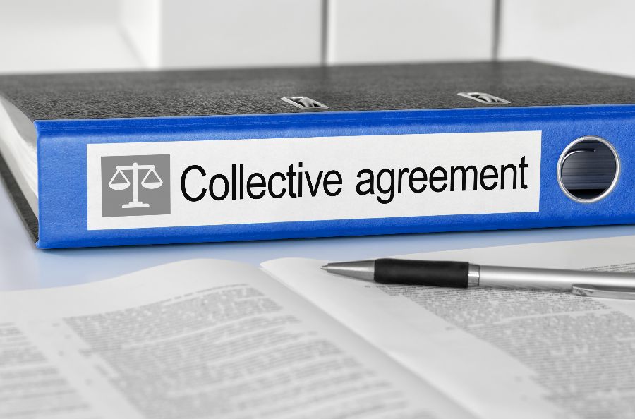 A blue folder marked Collective Agreements