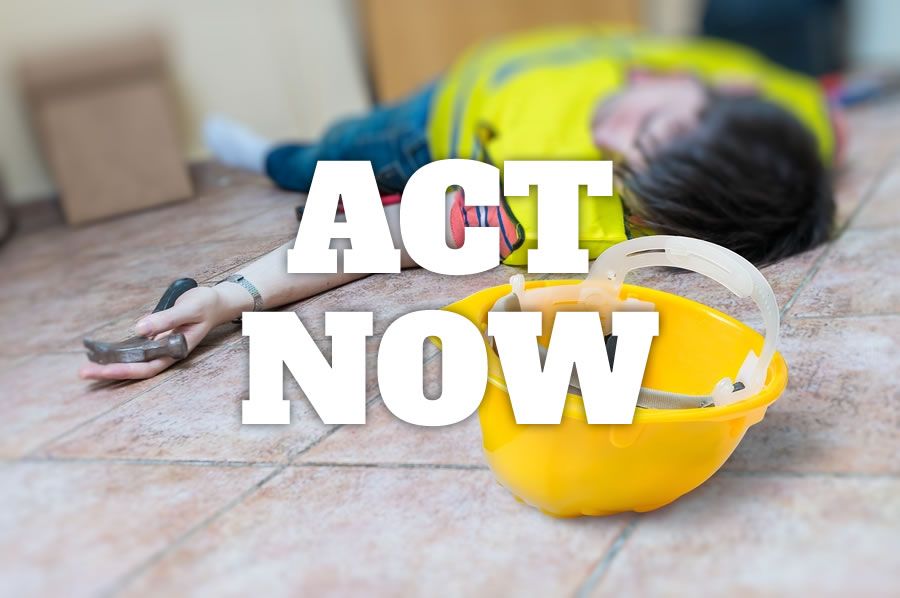 An injured worker lying on the floor