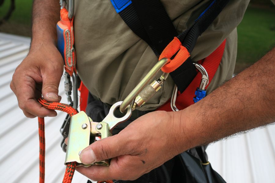 Close up of man's hands operating a buckle