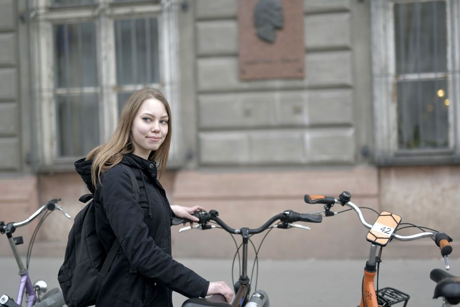A young woman and her bicycle