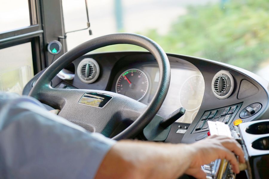 Close-up of coach steering wheel and dashboard